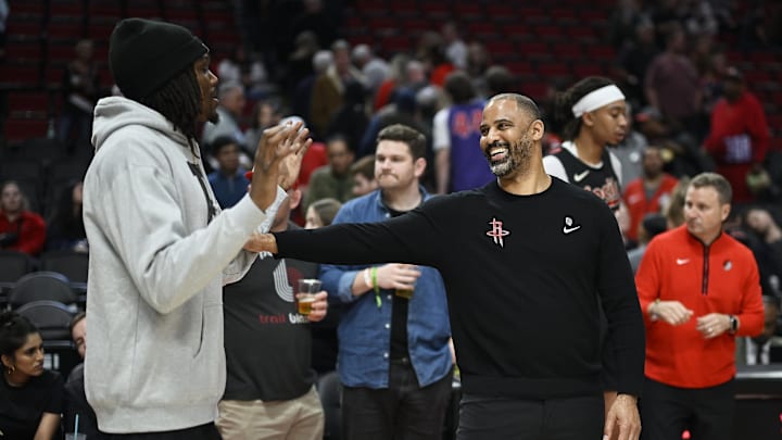 Apr 12, 2024; Portland, Oregon, USA; Houston Rockets head coach Ime Udoka visits with Portland Trail Blazers center Robert Williams III (35) after a game at Moda Center. Mandatory Credit: Troy Wayrynen-Imagn Images