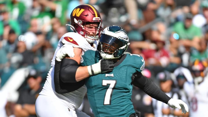 Oct 1, 2023; Philadelphia, Pennsylvania, USA; Philadelphia Eagles linebacker Haason Reddick (7) is blocked by Washington Commanders guard Andrew Wylie (71) at Lincoln Financial Field. 