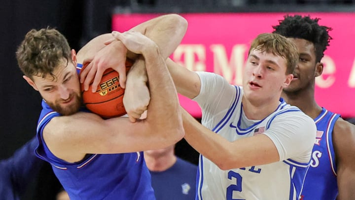 Vegas Showdown: Kansas v Duke; Duke basketball forward Cooper Flagg battles Kansas center Hunter Dickinson for a loose ball