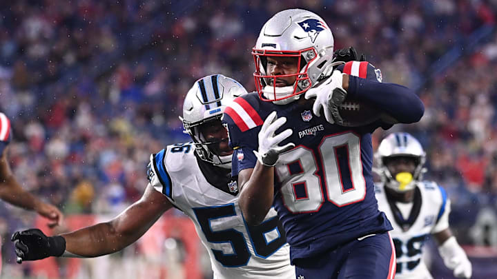 August 8, 2024; Foxborough, MA, USA;  New England Patriots wide receiver Kayshon Boutte (80) runs the ball with Carolina Panthers linebacker Trevin Wallace (56) in pursuit during the first half at Gillette Stadium. Mandatory Credit: Eric Canha-USA TODAY Sports