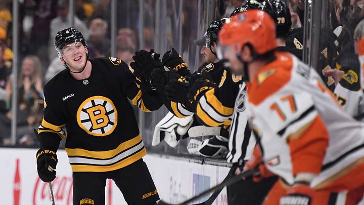 Oct 23, 2025; Boston, Massachusetts, USA; Boston Bruins defenseman Mason Lohrei (6) is congratulated by his teammates after scoring a goal during the second period against the Anaheim Ducks at TD Garden. Mandatory Credit: Bob DeChiara-Imagn Images