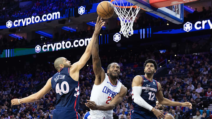 Mar 27, 2024; Philadelphia, Pennsylvania, USA; LA Clippers forward Kawhi Leonard (2) is fouled while driving for a score past Philadelphia 76ers forward Nicolas Batum (40) and forward Tobias Harris (12) to tie the game at 104 in the fourth quarter at Wells Fargo Center. Mandatory Credit: Bill Streicher-Imagn Images Mar 27, 2024; Philadelphia, Pennsylvania, USA; LA Clippers forward Kawhi Leonard (2) is fouled while driving for a score past Philadelphia 76ers forward Nicolas Batum (40) and forward Tobias Harris (12) to tie the game at 104 in the fourth quarter at Wells Fargo Center. Mandatory Credit: Bill Streicher-Imagn Images