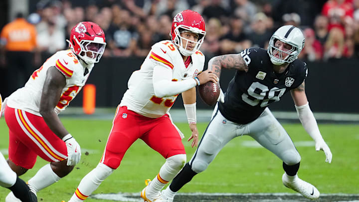 Oct 27, 2024; Paradise, Nevada, USA; Kansas City Chiefs quarterback Patrick Mahomes (15) is flushed out of the pocket by Las Vegas Raiders defensive end Maxx Crosby (98) during the second quarter at Allegiant Stadium. Mandatory Credit: Stephen R. Sylvanie-Imagn Images Oct 27, 2024; Paradise, Nevada, USA; Kansas City Chiefs quarterback Patrick Mahomes (15) is flushed out of the pocket by Las Vegas Raiders defensive end Maxx Crosby (98) during the second quarter at Allegiant Stadium. Mandatory Credit: Stephen R. Sylvanie-Imagn Images