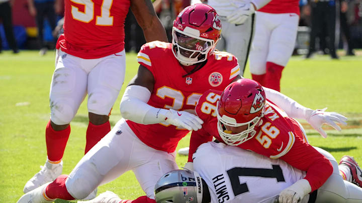 Oct 19, 2025; Kansas City, Missouri, USA; Kansas City Chiefs defensive end George Karlaftis (56) and linebacker Nick Bolton (32) tackle Las Vegas Raiders quarterback Geno Smith (7) during the second quarter of the game at GEHA Field at Arrowhead Stadium. Mandatory Credit: Denny Medley-Imagn Images Oct 19, 2025; Kansas City, Missouri, USA; Kansas City Chiefs defensive end George Karlaftis (56) and linebacker Nick Bolton (32) tackle Las Vegas Raiders quarterback Geno Smith (7) during the second quarter of the game at GEHA Field at Arrowhead Stadium. Mandatory Credit: Denny Medley-Imagn Images