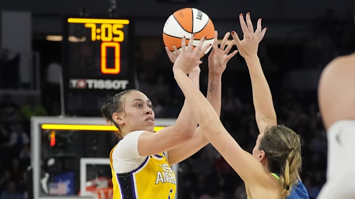 Jun 21, 2025; Minneapolis, Minnesota, USA; Los Angeles Sparks forward Dearica Hamby (5) shoots against Minnesota Lynx forward Alanna Smith (8) in the second quarter at Target Center. Mandatory Credit: Bruce Kluckhohn-Imagn Images