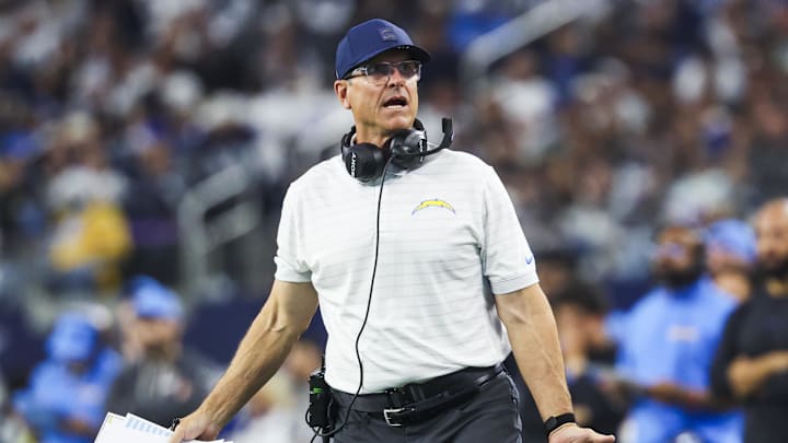 Dec 21, 2025; Arlington, Texas, USA; Los Angeles Chargers head coach Jim Harbaugh reacts to a play against the Dallas Cowboys during the first half at AT&T Stadium. Mandatory Credit: Kevin Jairaj-Imagn Images