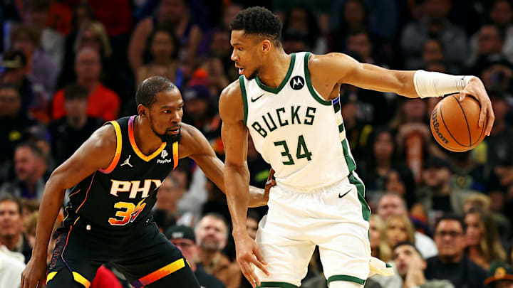 Feb 6, 2024; Phoenix, Arizona, USA; Milwaukee Bucks forward Giannis Antetokounmpo (34) handles the ball against the Phoenix Suns forward Kevin Durant (35) during the third quarter at Footprint Center. Mandatory Credit: Mark J. Rebilas-Imagn Images