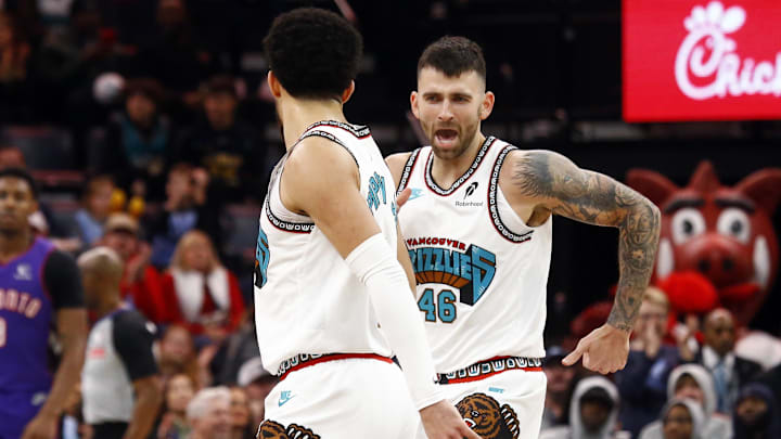 Dec 26, 2024; Memphis, Tennessee, USA; Memphis Grizzlies guard John Konchar (46) reacts with guard Scotty Pippen Jr. (1) during a time out during the fourth quarter against the Toronto Raptors at FedExForum. Mandatory Credit: Petre Thomas-Imagn Images