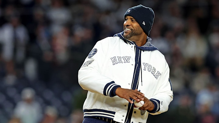 Oct 14, 2024; Bronx, New York, USA; New York Yankees former pitcher CC Sabathia throws the ceremonial first pitch before game one of the ALCS for the 2024 MLB Playoffs between the New York Yankees and the Cleveland Guardians at Yankee Stadium. Mandatory Credit: Brad Penner-Imagn Images
