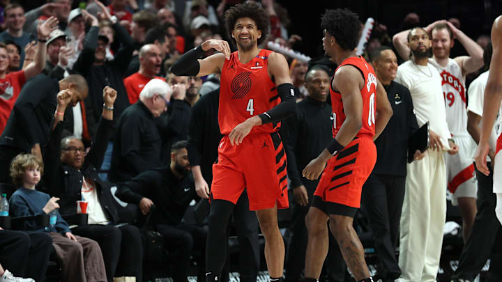 Mar 16, 2025; Portland, Oregon, USA;  Portland Trail Blazers guard Matisse Thybulle (4) reacts after blocking a three-point attempt by Toronto Raptors center Orlando Robinson (21) in the second half at Moda Center. Mandatory Credit: Jaime Valdez-Imagn Images