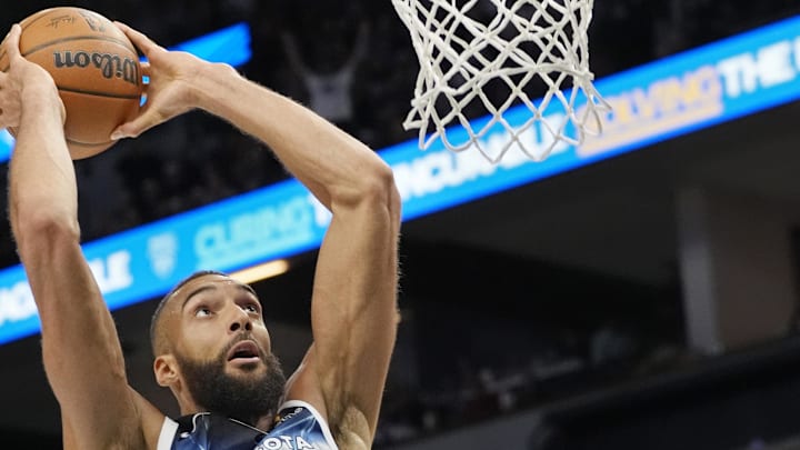 Apr 11, 2025; Minneapolis, Minnesota, USA; Minnesota Timberwolves center Rudy Gobert (27) dunks against the Brooklyn Nets in the third quarter at Target Center. Mandatory Credit: Bruce Kluckhohn-Imagn Images