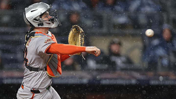 Apr 11, 2025; Bronx, New York, USA; San Francisco Giants catcher Patrick Bailey (14) throws the ball to second base as New York Yankees shortstop Anthony Volpe (not pictured) attempts a steal during the second inning at Yankee Stadium.