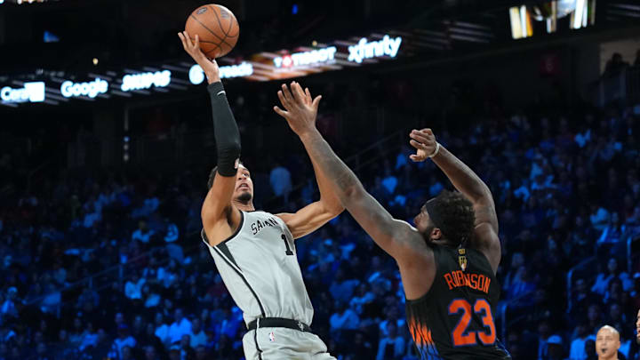 Dec 16, 2025; Las Vegas, Nevada, USA; San Antonio Spurs forward Victor Wembanyama (1) shoots the ball over New York Knicks center Mitchell Robinson (23) during the Emirates NBA Cup Final at T-Mobile Arena. Mandatory Credit: Kirby Lee-Imagn Images Dec 16, 2025; Las Vegas, Nevada, USA; San Antonio Spurs forward Victor Wembanyama (1) shoots the ball over New York Knicks center Mitchell Robinson (23) during the Emirates NBA Cup Final at T-Mobile Arena. Mandatory Credit: Kirby Lee-Imagn Images