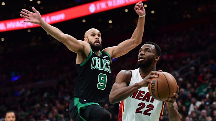 Feb 6, 2026; Boston, Massachusetts, USA;  Miami Heat forward Andrew Wiggins (22) drives to the basket past Boston Celtics guard Derrick White (9) during the first half at TD Garden. Mandatory Credit: Bob DeChiara-Imagn Images