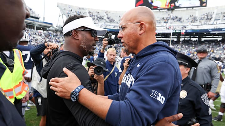 Penn State Nittany Lions head coach James Franklin (right) talks with FIU Panthers head coach Willie Simmons (left) following the game at Beaver Stadium. Penn State Nittany Lions head coach James Franklin (right) talks with FIU Panthers head coach Willie Simmons (left) following the game at Beaver Stadium.