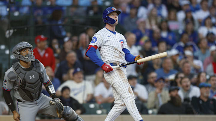 May 13, 2025; Chicago, Illinois, USA; Chicago Cubs center fielder Pete Crow-Armstrong (4) hits a solo home run against the Miami Marlins during the third inning at Wrigley Field. Mandatory Credit: Kamil Krzaczynski-Imagn Images