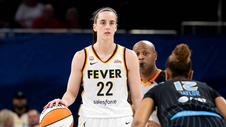 Caitlin Clark 22 of the Indiana Fever dribbles the ball down court against Sydney Taylor 12 of the Chicago Sky. Caitlin Clark 22 of the Indiana Fever dribbles the ball down court against Sydney Taylor 12 of the Chicago Sky.