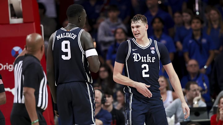 Jan 4, 2025; Dallas, Texas, USA;  Duke Blue Devils guard Cooper Flagg (2) celebrates with Duke Blue Devils center Khaman Maluach (9) during the second half against the Southern Methodist Mustangs at Moody Coliseum. Mandatory Credit: Kevin Jairaj-Imagn Images
