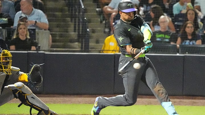 Tampa Bay Rays outfielder Christopher Morel (24) hits a single against the Milwaukee Brewers on Friday. Tampa Bay Rays outfielder Christopher Morel (24) hits a single against the Milwaukee Brewers on Friday.