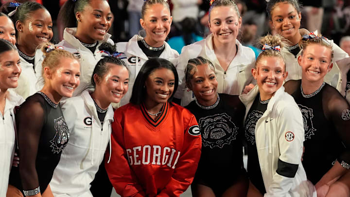 Simone Biles takes a group photo with the Gymdogs after a win over Boise State in Athens.