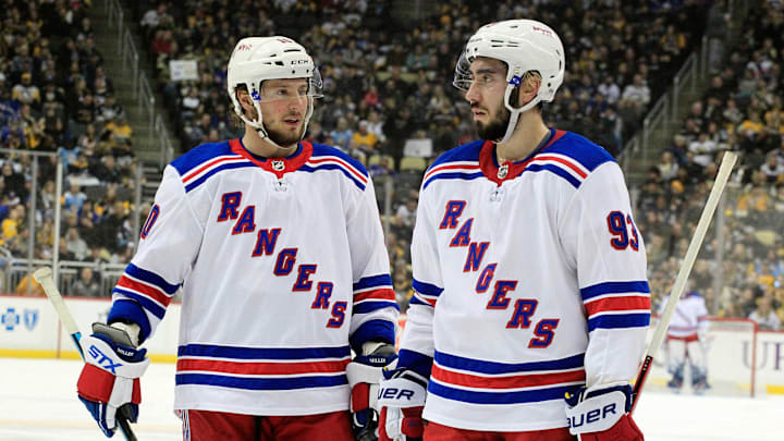 Jan 14, 2018; Pittsburgh, PA, USA;  New York Rangers left wing J.T. Miller (10) and center Mika Zibanejad (93) talk prior to a face-off against the Pittsburgh Penguins during the second period at PPG PAINTS Arena. The Penguins won 5-2. Mandatory Credit: Charles LeClaire-Imagn Images