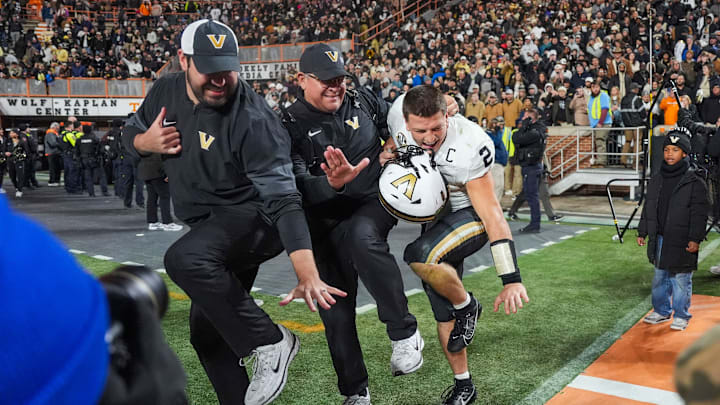 Vanderbilt quarterback Diego Pavia (2) poses as the Heisman trophy after winning a NCAA football game between Tennessee and Vanderbilt at Neyland Stadium in Knoxville, Tenn., on Nov. 29, 2025. Vanderbilt quarterback Diego Pavia (2) poses as the Heisman trophy after winning a NCAA football game between Tennessee and Vanderbilt at Neyland Stadium in Knoxville, Tenn., on Nov. 29, 2025.