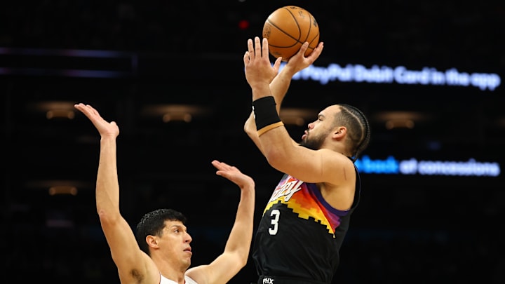 Jan 25, 2026; Phoenix, Arizona, USA; Phoenix Suns forward Dillon Brooks (3) shoots the ball against Miami Heat forward Simone Fontecchio (0) in the first half at Mortgage Matchup Center. Mandatory Credit: Mark J. Rebilas-Imagn Images