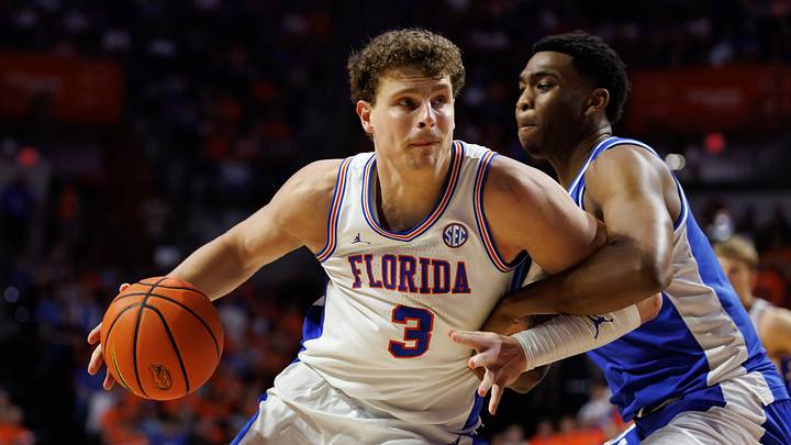 Florida Gators center Micah Handlogten (3) posts up against Kentucky Wildcats forward Brandon Garrison (10) during the second half at Exactech Arena at the Stephen C. O'Connell Center. Florida Gators center Micah Handlogten (3) posts up against Kentucky Wildcats forward Brandon Garrison (10) during the second half at Exactech Arena at the Stephen C. O'Connell Center.