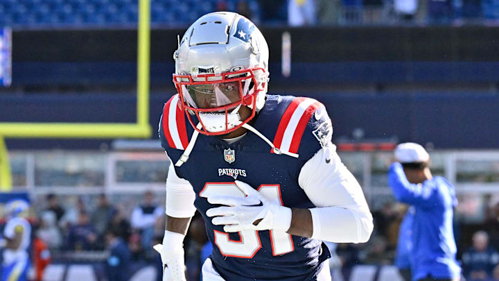 Nov 17, 2024; Foxborough, Massachusetts, USA; New England Patriots cornerback Jonathan Jones (31) warms up before a game against the Los Angeles Rams at Gillette Stadium. Mandatory Credit: Eric Canha-Imagn Images