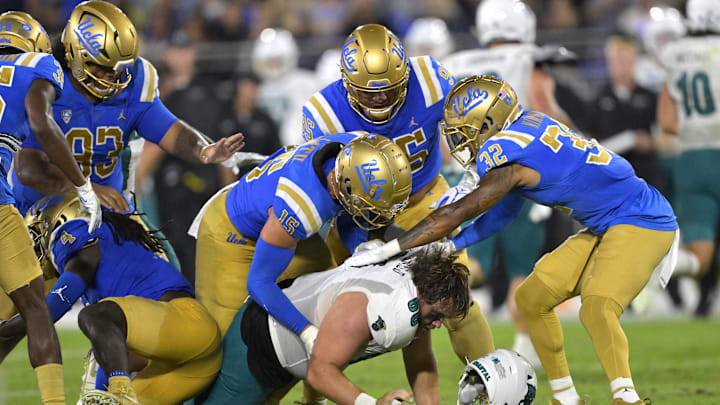 Sep 2, 2023; Pasadena, California, USA; Coastal Carolina Chanticleers offensive lineman Will McDonald (66) loses his helmet as he is stopped by the UCLA Bruins offense after an interception in the second half at Rose Bowl. Mandatory Credit: Jayne Kamin-Oncea-Imagn Images Sep 2, 2023; Pasadena, California, USA; Coastal Carolina Chanticleers offensive lineman Will McDonald (66) loses his helmet as he is stopped by the UCLA Bruins offense after an interception in the second half at Rose Bowl. Mandatory Credit: Jayne Kamin-Oncea-Imagn Images