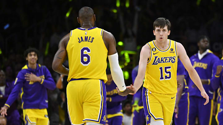 Apr 28, 2023; Los Angeles, California, USA; Los Angeles Lakers guard Austin Reaves (15) celebrates with forward LeBron James (6) after a 3-point basket in the first quarter of game six of the 2023 NBA playoffs against the Memphis Grizzlies at Crypto.com Arena. Mandatory Credit: Jayne Kamin-Oncea-Imagn Images