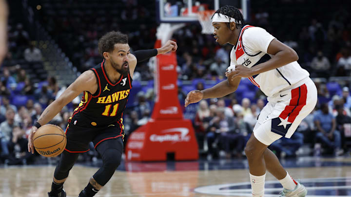 Oct 30, 2024; Washington, District of Columbia, USA; Atlanta Hawks guard Trae Young (11) drives to the basket as Washington Wizards guard Bilal Coulibaly (0) defends in the first half at Capital One Arena. Mandatory Credit: Geoff Burke-Imagn Images