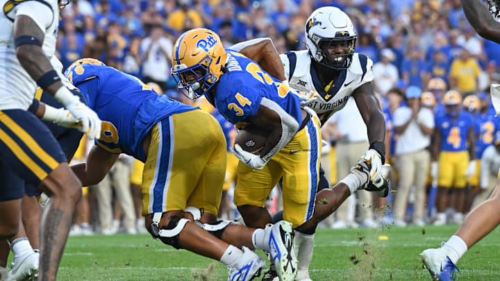 Sep 14, 2024; Pittsburgh, Pennsylvania, USA; Pittsburgh Panthers running back Derrick Davis Jr. (34) scores a touchdown against the West Virginia Mountaineers during the fourth quarter at Acrisure Stadium. Mandatory Credit: Barry Reeger-Image Images Sep 14, 2024; Pittsburgh, Pennsylvania, USA; Pittsburgh Panthers running back Derrick Davis Jr. (34) scores a touchdown against the West Virginia Mountaineers during the fourth quarter at Acrisure Stadium. Mandatory Credit: Barry Reeger-Image Images
