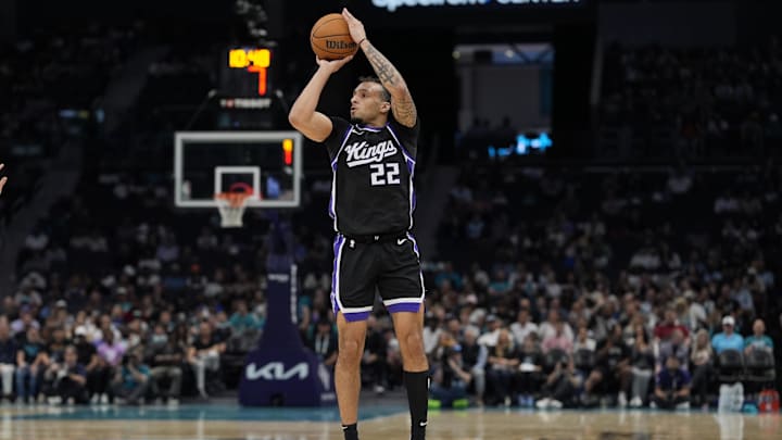 Apr 4, 2025; Charlotte, North Carolina, USA; Sacramento Kings guard Devin Carter (22) with a jump shot against the Charlotte Hornets during the second quarter at Spectrum Center. Mandatory Credit: Jim Dedmon-Imagn Images