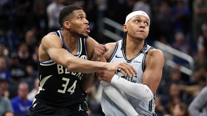Milwaukee Bucks forward Giannis Antetokounmpo (34) guards Orlando Magic forward Paolo Banchero (5) in the fourth quarter at Kia Center.