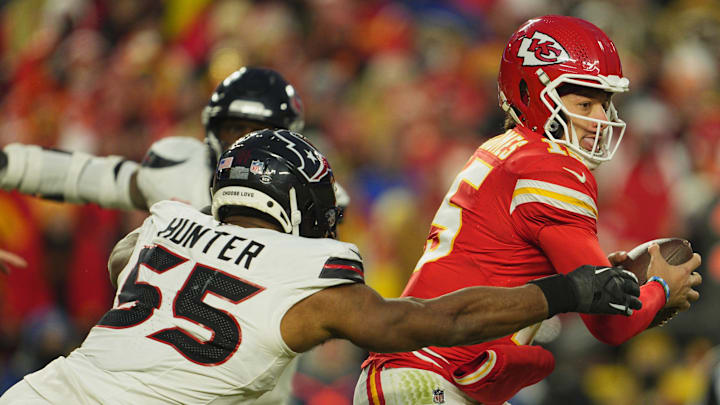 Jan 18, 2025; Kansas City, Missouri, USA; Houston Texans defensive end Danielle Hunter (55) tackles Kansas City Chiefs quarterback Patrick Mahomes (15) during the third quarter of a 2025 AFC divisional round game at GEHA Field at Arrowhead Stadium. Mandatory Credit: Jay Biggerstaff-Imagn Images