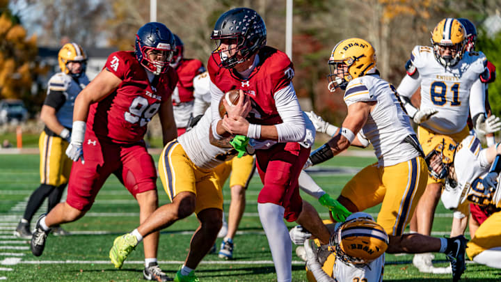 Tabor Academy's quarterback Peter Bourque runs in a touchdown on the opening drive against the BB&N Knights . JOSH SOUZA/STANDARD-TIMES SPECIAL