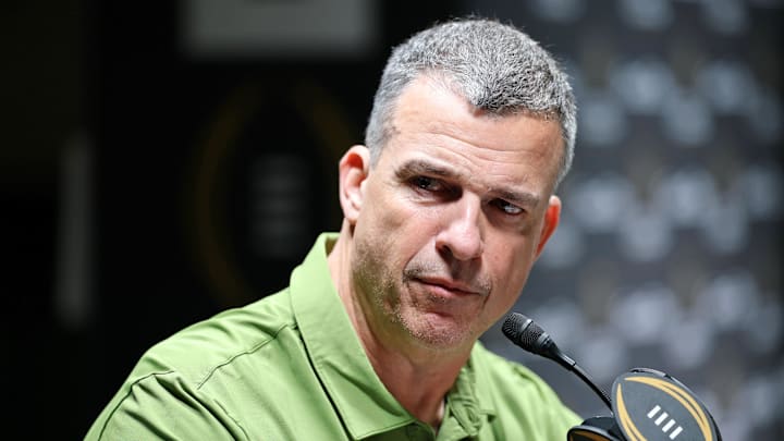 Jan 17, 2026; Miami Gardens, FL, USA; Miami Hurricanes head coach Mario Cristobal talks to the media during media day for the 2025 College Football Playoff National Championship at Miami Beach Convention Center. Mandatory Credit: Nathan Ray Seebeck-Imagn Images