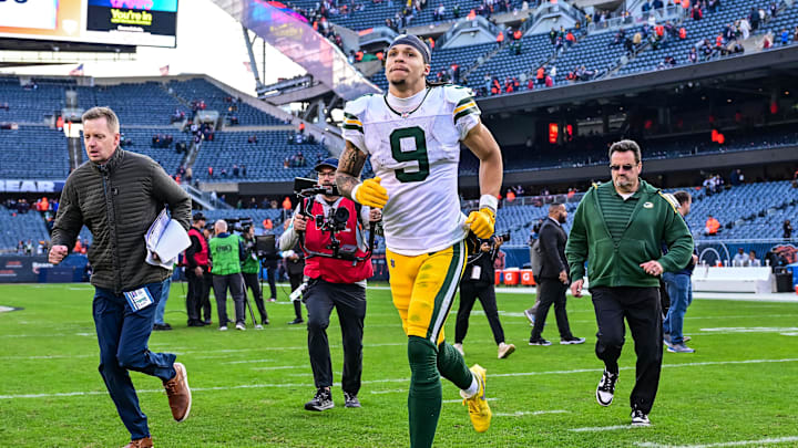 Green Bay Packers wide receiver Christian Watson (9) runs off the field after the victory over the Chicago Bears.