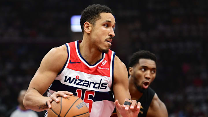 Dec 3, 2024; Cleveland, Ohio, USA; Washington Wizards guard Malcolm Brogdon (15) drives to the basket against Cleveland Cavaliers guard Donovan Mitchell (45) during the first quarter at Rocket Mortgage FieldHouse. Mandatory Credit: Ken Blaze-Imagn Images