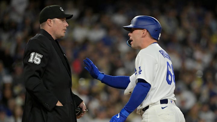 Apr 28, 2026; Los Angeles, California, USA; Los Angeles Dodgers catcher Dalton Rushing (68) argues with home plate umpire umpire Clint Vondrak (15) after he was called for strike 3 on a pitch clock violation -against the Miami Marlins at Dodger Stadium. Mandatory Credit: Jayne Kamin-Oncea-Imagn Images