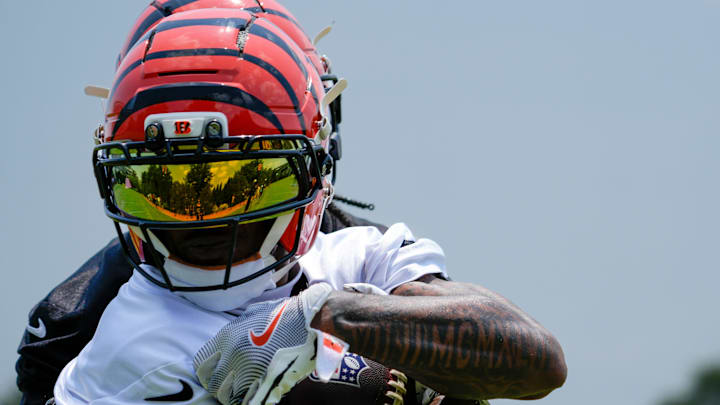 Cincinnati Bengals wide receiver Ja'Marr Chase (1) pulls in a catch during a session of organized team activities on the Bengals practice field at Paycor Stadium in downtown Cincinnati on Tuesday, June 3, 2025.