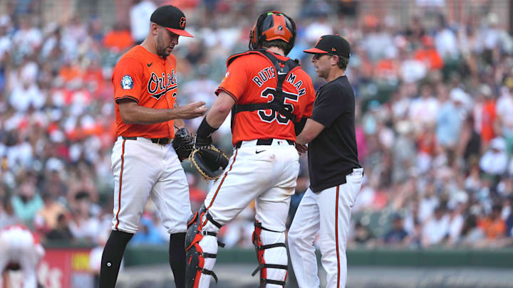 Jul 13, 2024; Baltimore, Maryland, USA; Baltimore Orioles pitcher Grayson Rodriguez (left) is joined by catcher Adley Rutschman (center) and coach Drew French (right) during the fifth inning against the New York Yankees at Oriole Park at Camden Yards. Jul 13, 2024; Baltimore, Maryland, USA; Baltimore Orioles pitcher Grayson Rodriguez (left) is joined by catcher Adley Rutschman (center) and coach Drew French (right) during the fifth inning against the New York Yankees at Oriole Park at Camden Yards.
