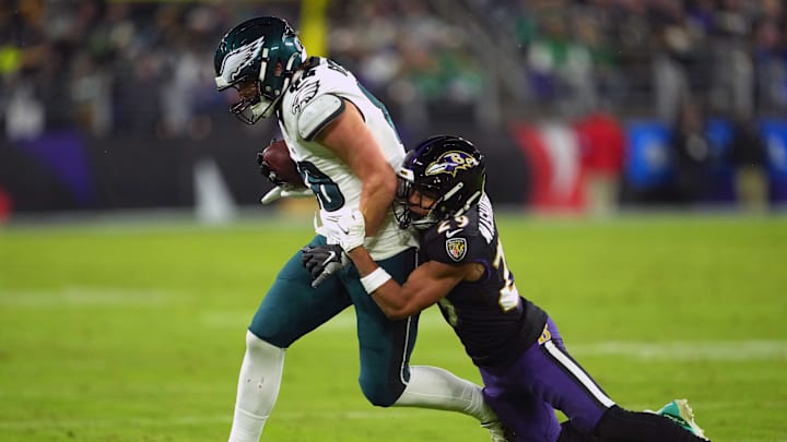 Dec 1, 2024; Baltimore, Maryland, USA; Philadelphia Eagles tight end Dallas Goedert (88) gains yardage after a third quarter catch defended by Baltimore Ravens safety Ar’Darius Washington (29) at M&T Bank Stadium. Mandatory Credit: Mitch Stringer-Imagn Images