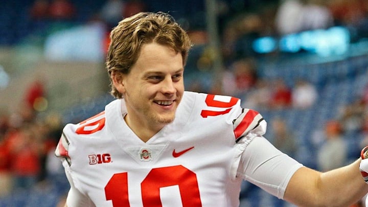 Ohio State quarterbacks Joe Burrow (10) and J.T. Barrett warm up before the Big Ten Championship game on Dec. 2, 2017.

Osu17b10 Bjp 06
