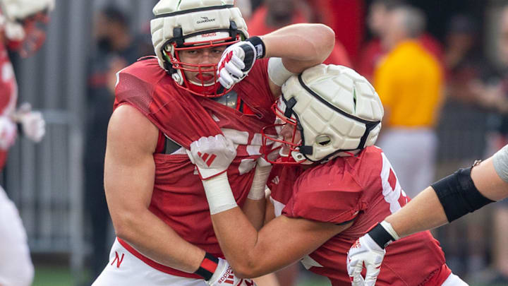 Nebraska tight end Eric Ingwerson pushes offensive lineman Shawn Hammerbeck back during a drill at the Big Red Previewearlier this month.