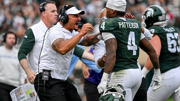 Michigan State’s running back coach Devon Spalding, left, celerbates with Jaziun Patterson after his touchdown against Illinois during the third quarter on Saturday, Oct. 10, 2026, at Spartan Stadium in East Lansing. Michigan State’s running back coach Devon Spalding, left, celerbates with Jaziun Patterson after his touchdown against Illinois during the third quarter on Saturday, Oct. 10, 2026, at Spartan Stadium in East Lansing.