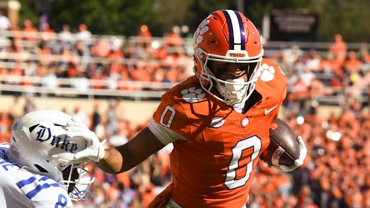 Clemson Tigers wide receiver Antonio Williams (0) stiff-arms Duke Blue Devils safety DaShawn Stone (8) Saturday, Nov. 1, 2025, during the NCAA football game at Memorial Stadium in Clemson, South Carolina.