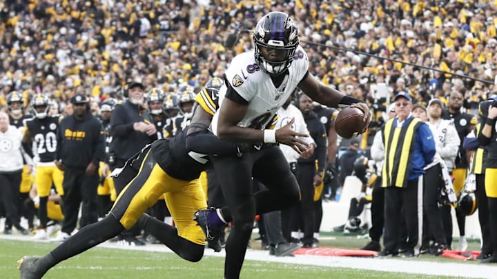 Nov 17, 2024; Pittsburgh, Pennsylvania, USA;  Pittsburgh Steelers cornerback Joey Porter Jr. (24) stops Baltimore Ravens quarterback Lamar Jackson (8) short of the end-zone on a two point conversion attempt during the fourth quarter at Acrisure Stadium. Mandatory Credit: Charles LeClaire-Imagn Images