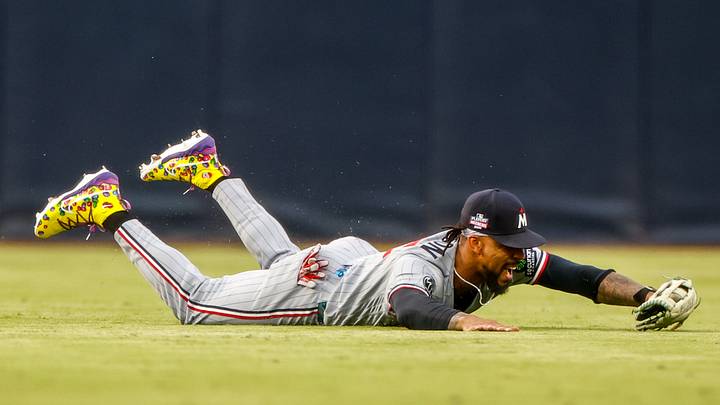 Aug 21, 2026; San Diego, California, USA;  Minnesota Twins center fielder Byron Buxton (25) makes a diving catch during the second inning against the San Diego Padres at Petco Park.  Mandatory Credit: David Frerker-Imagn Images
